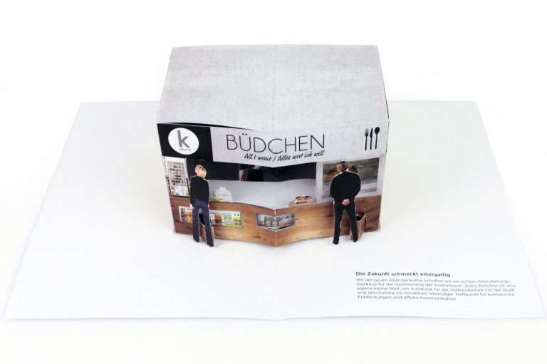 Pop up Karte eines Kiosk mit zwei Figuren davor