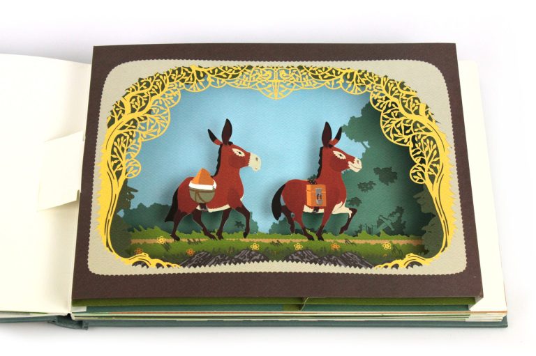 Zwei Esel in einem farbenfrohen Pop-up-Buch mit filigranem Rahmen.