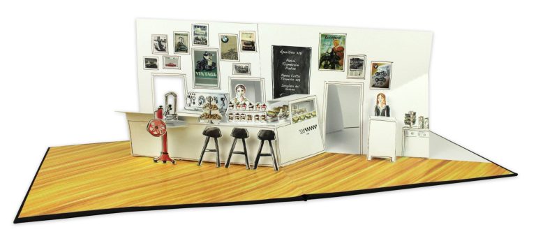 Pop up Café-Szene mit Theke, Stühlen und neugestalteten Wänden voller Kunstwerke.